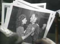 Reineke's propaganda photo's, of Major Richter (Alfred Burke) dancing with Marie Weston (Sheridan Fitzgerald).