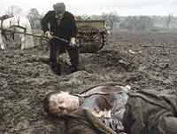 Walter Nicolle (Neil McCarthy) digs a grave for the German soldier.