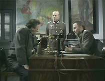 Doctor Martel (Bernard Horsfall), Oberleutnant Otto Kluge (John Malcolm) and Major-Doktor Dieter Richter (Alfred Burke) discuss the Bree estate's water supply.