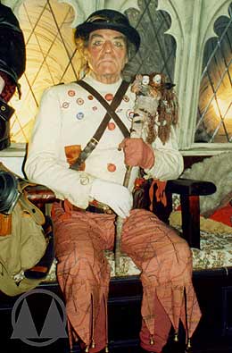 Terrific costume work for the Tooley (Arthur Whybrow). Note the Underground map trousers, the Tube roundel badges, the ticket collector's straps across his chest, and the adapted Action Men dolls incorporated into his rattle.