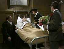 Mick Murphy (J.G.Devlin) is visited in hospital by neighbour Jimmy (Alan Hockey), Bella Seaton (Jean Heywood) and Ralph Murphy (John White).