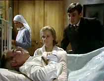 Bill Seaton (James Garbutt), in hospital following his mining accident, is visited by Bella (Jean Heywood) and Billy (Edward Wilson).