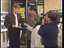 Gary (Nicholas Lyndhurst) and Ron (Victor McGuire) are interviewed by a TV reporter (Suzy Aitchison)